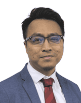 Modern professional portrait of a businessman in a blue suit and glasses for corporate branding.