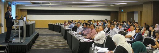 Professional conference with diverse attendees and expert speaker at RIMA event.