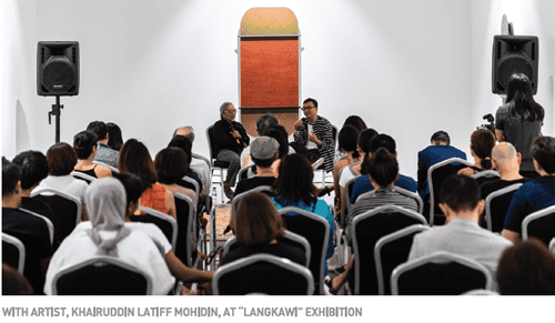 A diverse audience attends a Q&A session with artist Khajiru Dinj at the Langkawi exhibition.